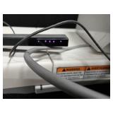 Nintendo Wii console with a Wii Balance Board and various accessories