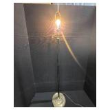 mid-century modern design LAMP with a brass swing arm and a dark stem