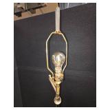 mid-century modern design LAMP with a brass swing arm and a dark stem