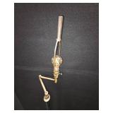 mid-century modern design LAMP with a brass swing arm and a dark stem