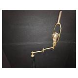 mid-century modern design LAMP with a brass swing arm and a dark stem