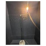 mid-century modern design LAMP with a brass swing arm and a dark stem