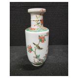 Chinese Porcelain Vase depicting flowers, vines and a little green bird