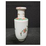 Chinese Porcelain Vase depicting flowers, vines and a little green bird