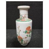 Chinese Porcelain Vase depicting flowers, vines and a little green bird