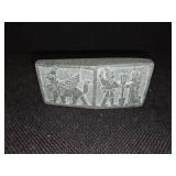 Cambodian stone artifact depicting carvings of an ancient race.