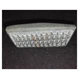 Cambodian stone artifact depicting carvings of an ancient race.