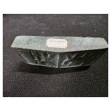 Cambodian stone artifact depicting carvings of an ancient race.