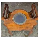Antique Wooden Vanity with an Oval Mirror