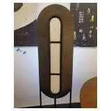 A modern "Race Track" Floor Lamp by Maria Yee.