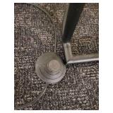 A modern "Race Track" Floor Lamp by Maria Yee.