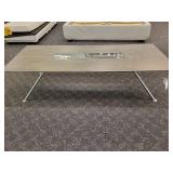 Modern Cocktail Table with a wood grain design, inset glass panel and chrome legs. Made by Fjords Furniture of Norway.