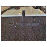 A pair of white side tables with chrome legs by A.L.F. Italy.