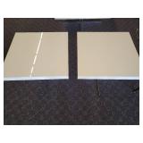 A pair of white side tables with chrome legs by A.L.F. Italy.