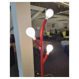 A Caligaris "Pom Pom" Floor Lamp.