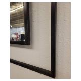 Black Iron Framed Wall Mirror with a Windowpane Design.