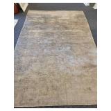 A  9" x 13" Silk Area Rug.