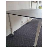 A Counter Height Table with a Ceramic Top by Johnston Casuals.