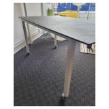A Counter Height Table with a Ceramic Top by Johnston Casuals.