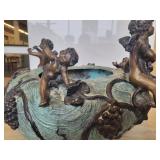 An Art Nouveau Style Patinated Bronze Jardiniere with Cherubs Playing Musical Instruments.
