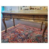 A DREXEL HERITAGE CHINOISERIE WRITING DESK WITH GLASS PROTECTOR.