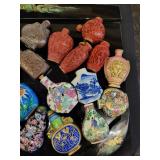A lot of 27 Snuff Bottles. 8 bottles are missing their stops. Cinnabar. Painted. Etc.