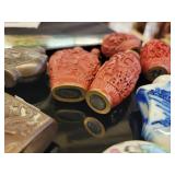 A lot of 27 Snuff Bottles. 8 bottles are missing their stops. Cinnabar. Painted. Etc.