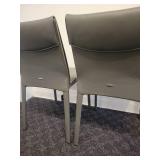 A Pair of Leather Chairs by Cattelan.