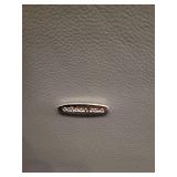 A Pair of Leather Chairs by Cattelan.