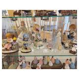 A Six Shelf Glass Display Case including all contents shown in pictures.