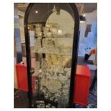 A Black Curved Top Display Case with all contents included.