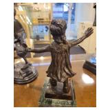 A group of 4 Bronze Statues.  Children Leapfrogging and Blindfolded Girl.