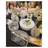 A table full of Porcelain Shoes, Figurines, Music and plain Boxes, Collectibles etc.