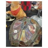 A table full of Figurines, Dolls, Glassware, Leaded Glass Sconce Cover, China, Perfumes etc.