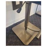 A single, very Modern Swivel Bar Stool.