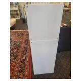 A 2 piece, 12 cubby wood storage unit in white.