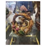 A table full of Decor / Collectible Items. Painted Ostrich Egg, Oriental T-Pots, Vases, Decor etc.