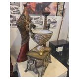 A group lot of items. Rams Head Urn, A Floor Candlestick, Decorative Metal Stand & Abstract Wood Figure.