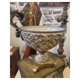 A group lot of items. Rams Head Urn, A Floor Candlestick, Decorative Metal Stand & Abstract Wood Figure.