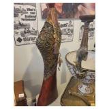 A group lot of items. Rams Head Urn, A Floor Candlestick, Decorative Metal Stand & Abstract Wood Figure.