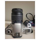 2 Cameras: Canon Rebel 2000 EOS & Canon EX Auto with lenses.