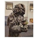 A Bronze Statue of of Ebenezer Scrooge: Candle Holder.