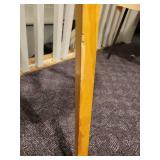 A Tripod Floor Lamp with wood legs.