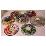 LR - Collection of Hot Wheels Cars in 7 Round Containers Including McDonalds, Quaker State, Firebird and More