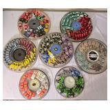 LR - Collection of Hot Wheels Cars in 7 Round Containers Including McDonalds, Quaker State, Firebird and More