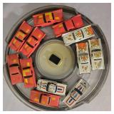 LR - Collection of Hot Wheels Cars in 7 Round Containers Including McDonalds, Quaker State, Firebird and More