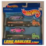 LR - Collection of 8 Hot Wheels Long Haulers and Racing Hauler Packs