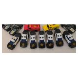 K - Collection of 32 Die-Cast Emergency Vehicles Including Police Cars, Fire Trucks, and Ambulances