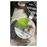 Pallet Lot of Garden Accessories Box with Tumbling Composter, Power Blaster, Glass Table, and Plant Supplies