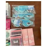 Large Group of Beauty and Personal Care Items including Gel Eye Masks, Fake Nails, and Sprays